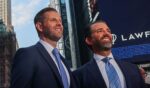 Eric Trump, left, and his brother Donald Trump Jr. are pictured in New York City's Times Square in 2025.