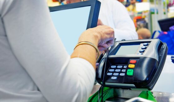 Investigators said the woman used EBT cards at stores and also traded them for illicit drugs.