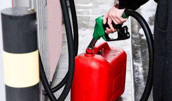 Gasoline is pumped into a can.