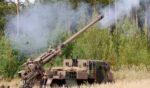 A howitzer blows off steam after firing in a field on September 16, 2026.