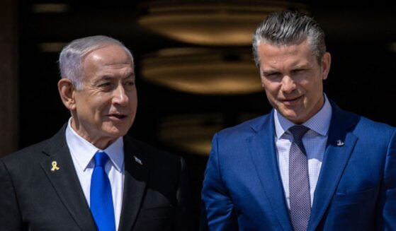 Prime Minister of Israel Benjamin Netanyahu and Secretary of War Peter Hegseth walk down stairs together on July 9, 2025 at the Pentagon.