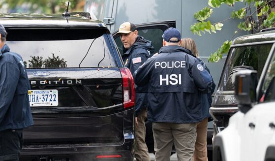 Homeland Security Investigations police search the Washington, D.C., home of Rep. Ilhan Omar, a Minnesota Democrat, Monday.
