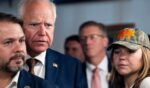 Vice Presidential candidate and Minnesota Governor Tim Walz stands with his daughter Hope Walz and DemocraticCongressman Ruben Gallego of Arizona in Phoenix, Arizona, on Aug. 9, 2024.