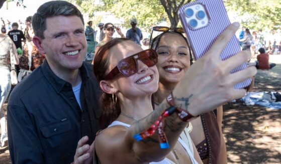 Politician James Talarico poses for pictures with fans in Austin, Texas, on Oct. 9, 2026.