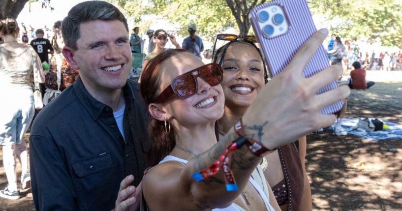 Politician James Talarico poses for pictures with fans in Austin, Texas, on Oct. 9, 2026.