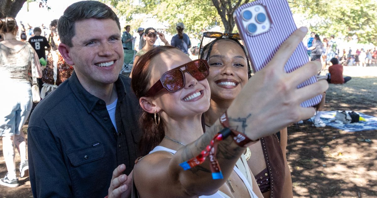 Politician James Talarico poses for pictures with fans in Austin, Texas, on Oct. 9, 2026.
