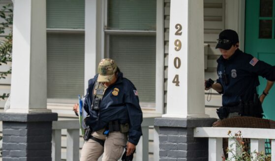 Homeland Security Investigations police search the Washington, D.C. home of Rep. Ilhan Omar, a Minnesota Democrat, Monday.