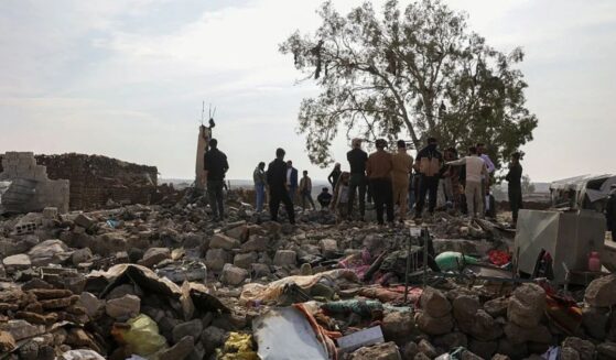 People inspect the damage Tuesday at a site targeted by airstrikes, carried out the night before by Jordan on the village of Al-Taf in the Al-Lajat region, located in the northeastern countryside of Daraa. Jordan said it had killed more than 20 Islamic State group jihadists in strikes on Syria in retaliation for a deadly attack on a church.