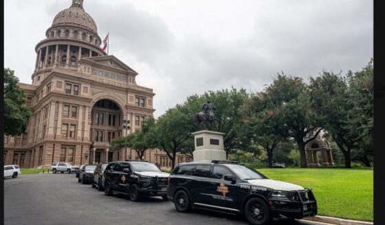 Texas Department of Public Safety vehicles sit parked outside of the Texas State Capitol in Austin, Texas Thursday. Officials announced that they received information about a planned attack on the Capitol.
