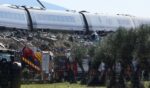 Emergency workers gather near the scene of a train crash Wednesday near Los Yébenes, Toledo, Spain. At least 64 people are reported to have been killed after a high-speed Renfe train hit an Iryo train between the towns of Mora and Orgaz and Urda in Toledo province.