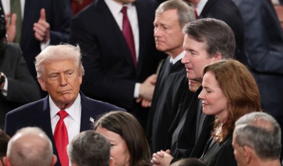 President Donald Trump walks past Supreme Court Chief Justice John Roberts, Associate Justice Elena Kagan, Associate Justice Brett Kavanaugh and Associate Justice Amy Coney Barrett on Feb. 24 as he arrives for the State of the Union address during a joint session of Congress at the U.S. Capitol in Washington, D.C.