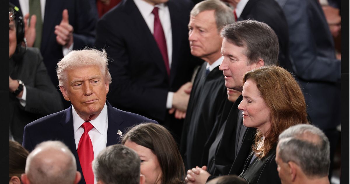 President Donald Trump walks past Supreme Court Chief Justice John Roberts, Associate Justice Elena Kagan, Associate Justice Brett Kavanaugh and Associate Justice Amy Coney Barrett on Feb. 24 as he arrives for the State of the Union address during a joint session of Congress at the U.S. Capitol in Washington, D.C.