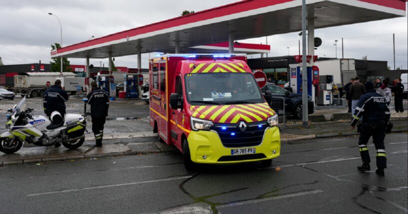 Police and firefighters on the scene of a shooting Friday in the Paris suburb of Trappes.