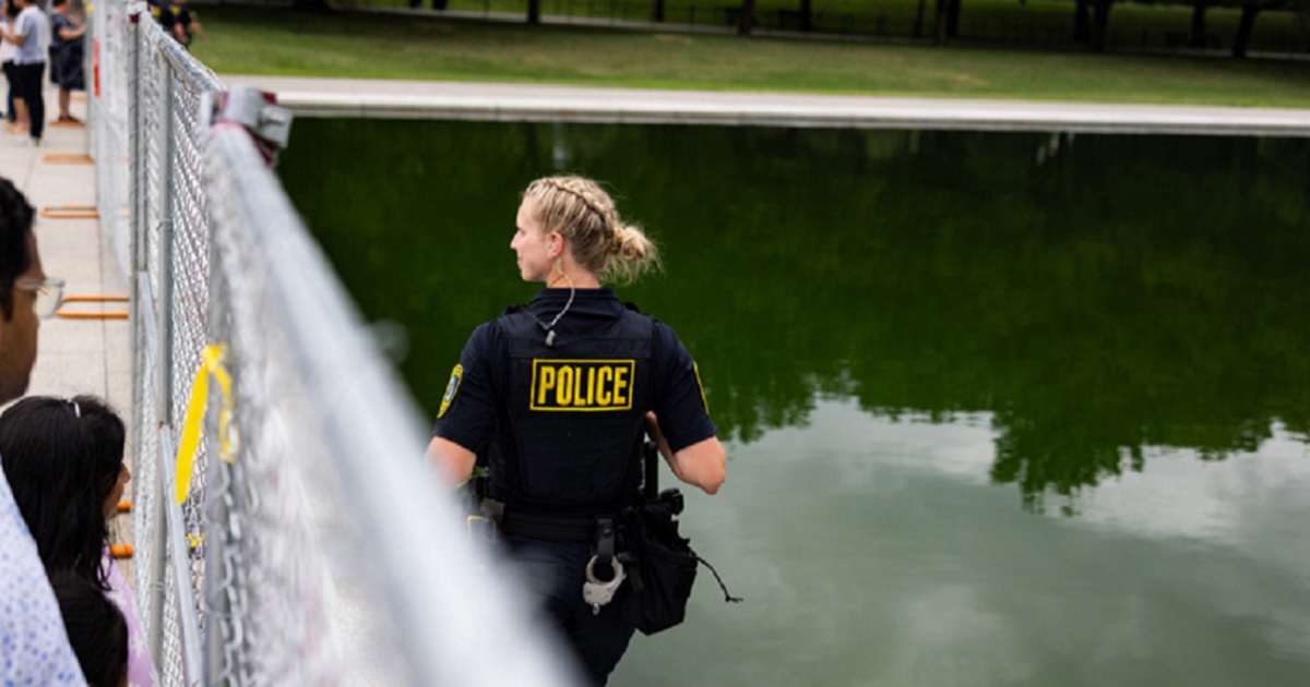 Police patrol the Lincoln Memorial Reflecting Pool in a June file photo during a controversy over vandalism at the pool aimed at embarrassing President Donald Trump.