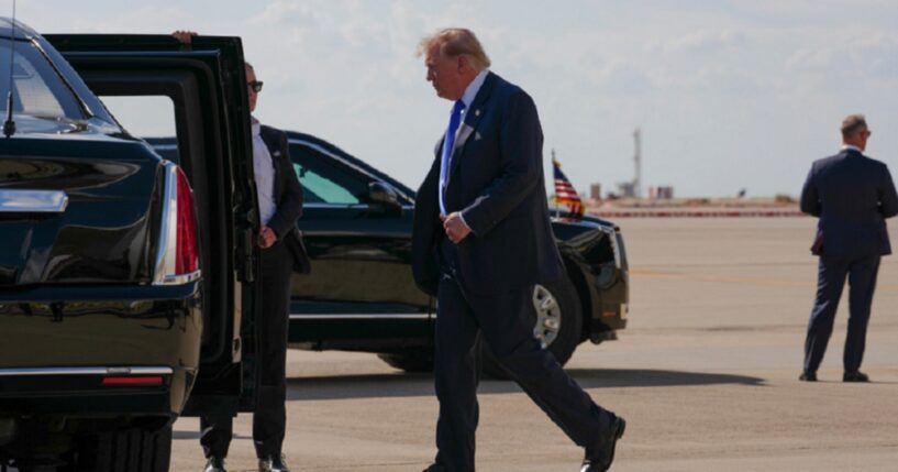 President Donald Trump walks to the presidential limousine nicknamed "The Beast" in a September file photo from the Dallas-Fort Worth Airport.
