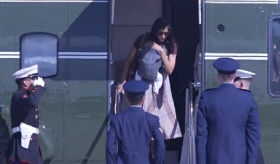 Second lady Usha Vance, carrying her infant child, prepares to disembark Marine Two, the vice presidential helicopter.