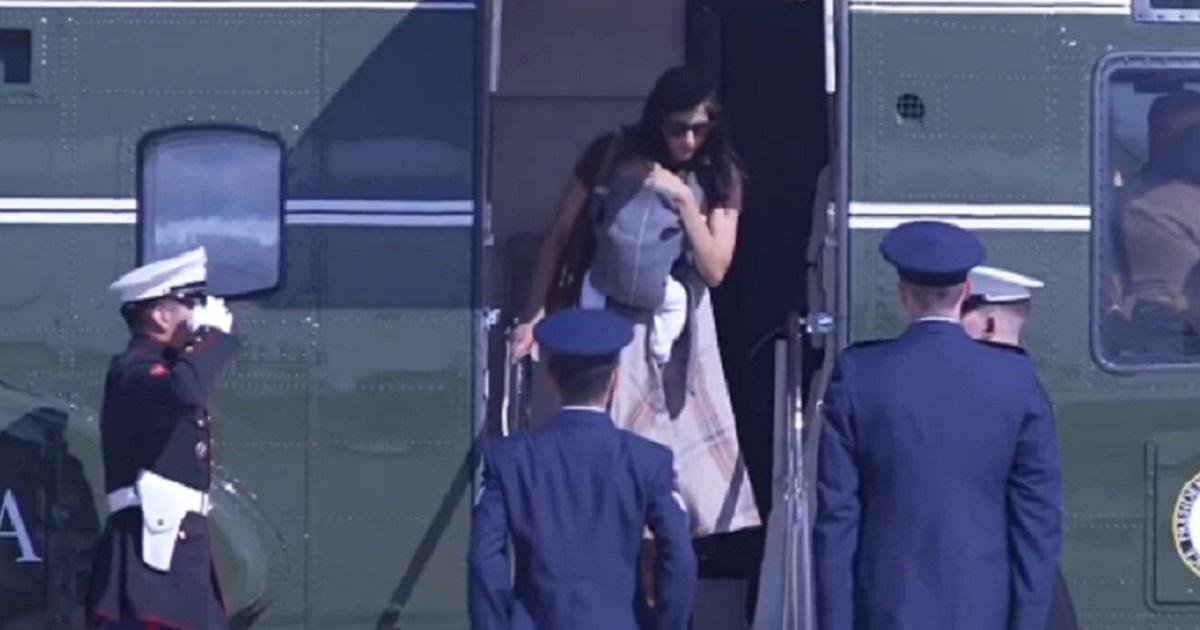 Second lady Usha Vance, carrying her infant child, prepares to disembark Marine Two, the vice presidential helicopter.